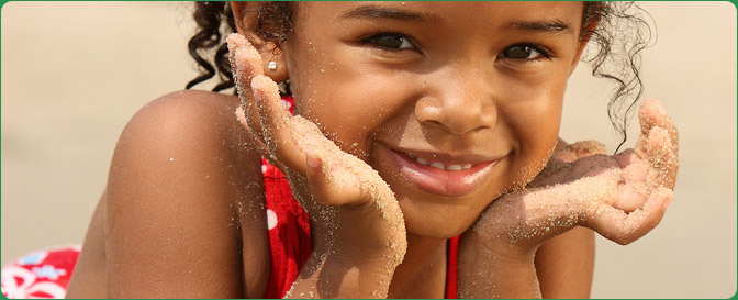 Young girl playing on the beach