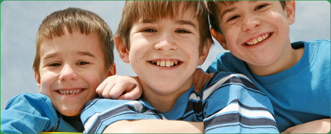 Three brothers smiling